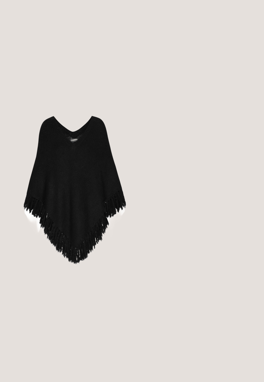 Zwarte gebreide poncho met een V-hals en franjes aan de onderkant. Zachte textuur, losse pasvorm en driehoekige vorm voor gemakkelijke layering en comfort.; Zwarte lange mouw fitted coltrui met een subtiel bloemenpatroon en rechte zoom.; Persoon die zwarte skinny jeans met hoge taille en zwarte puntige pumps draagt, staand tegen een effen witte achtergrond.; Zwarte enkellaars gemaakt van glad materiaal, met een blokhak en subtiele stikdetails. Het ontwerp is strak met een ritssluiting aan de voorkant.; Zwarte totebag vanTextuur materiaal met gouden hardware accenten, dubbele bovenhandvatten en een verstelbare schouderriem. Minimalistisch ontwerp.; Roze gouden gelaagde ketting met twee kettingen, ronde kralen en een cirkelvormige hanger in het midden. Luxe metalen afwerking.