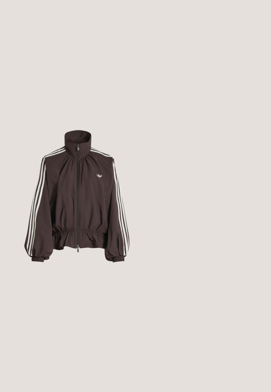 Dark brown zip-up track jacket with white three-stripe details on sleeves, elastic cuffs and hem, and small white logo on chest.; Dark brown zip-up jacket with high collar, long sleeves, two side pockets, and a small white Adidas logo on the chest.; White long-sleeve shirt with a scooped neckline and a short button placket on the chest, displayed against a plain light background.; Black track pants with yellow side stripes, elastic waistband, zippered side pockets, and a small logo on the upper thigh.; Tan and cream athletic shoes with a smooth leather upper, three white stripes on the side, and a rounded toe. Textured upper with perforations.; Olive green Adidas shoulder bag with adjustable strap, front flap, and logo patch centered on the front pocket.