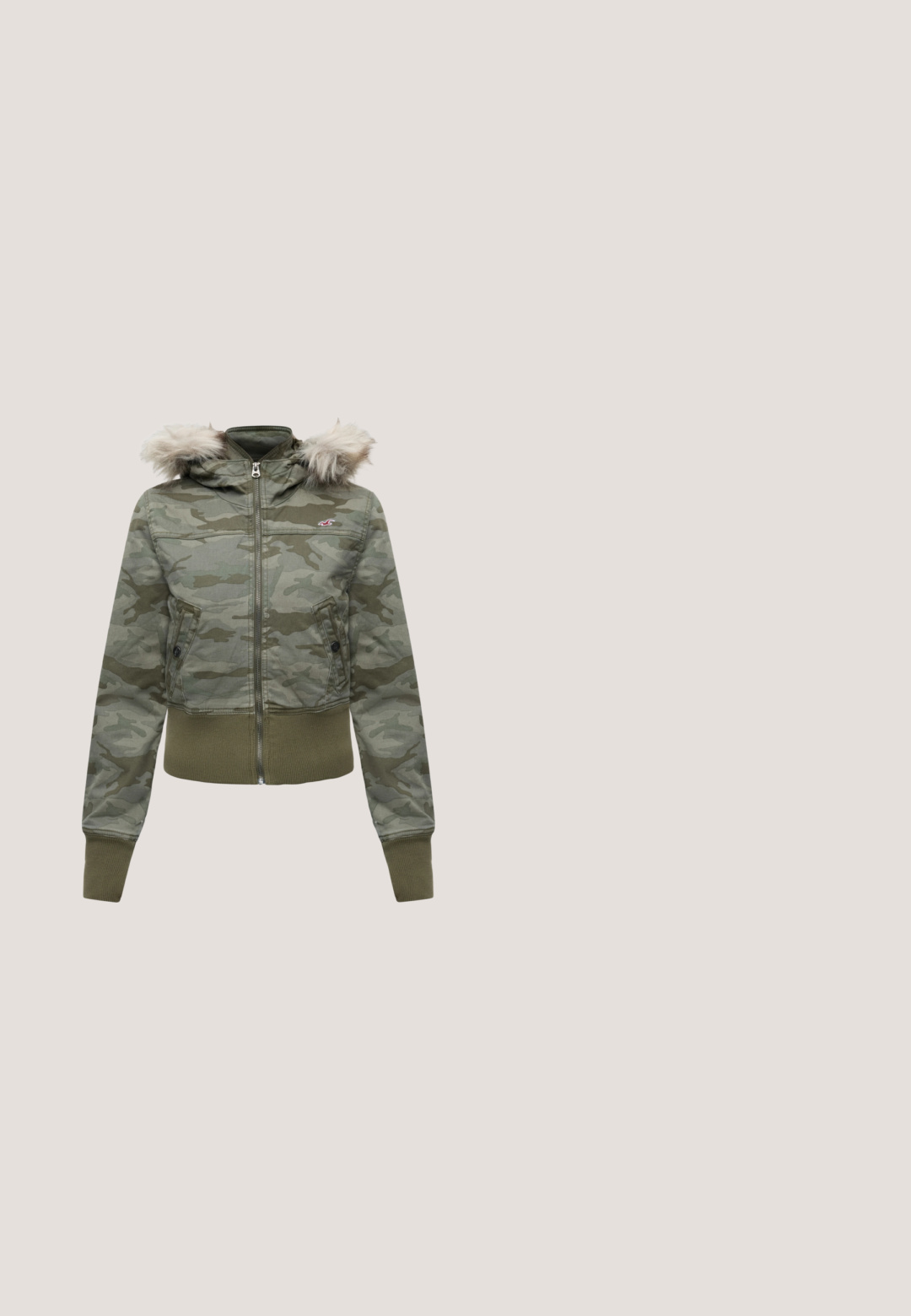 Green camouflage zip-up jacket with fur-trimmed hood, ribbed cuffs and hem, and two front pockets with button flaps.; Long-sleeve olive green henley shirt with button placket and Tokyo 75 graphic in red and white on the front.; Pair of plain gray flared pants with a wide waistband featuring a small red and white logo on the top right side.; Cream-colored sneakers with a smooth leather upper, metallic gold accents on the heel, and a textured platform sole. Subtle studded details.; Black leather shoulder bag with a buckle strap detail, curved edges, and contrasting white stitching on a plain background.; Silver-tone earrings featuring a chain design with a clear rhinestone-accented clasp at the top. Smooth texture, modern silhouette.