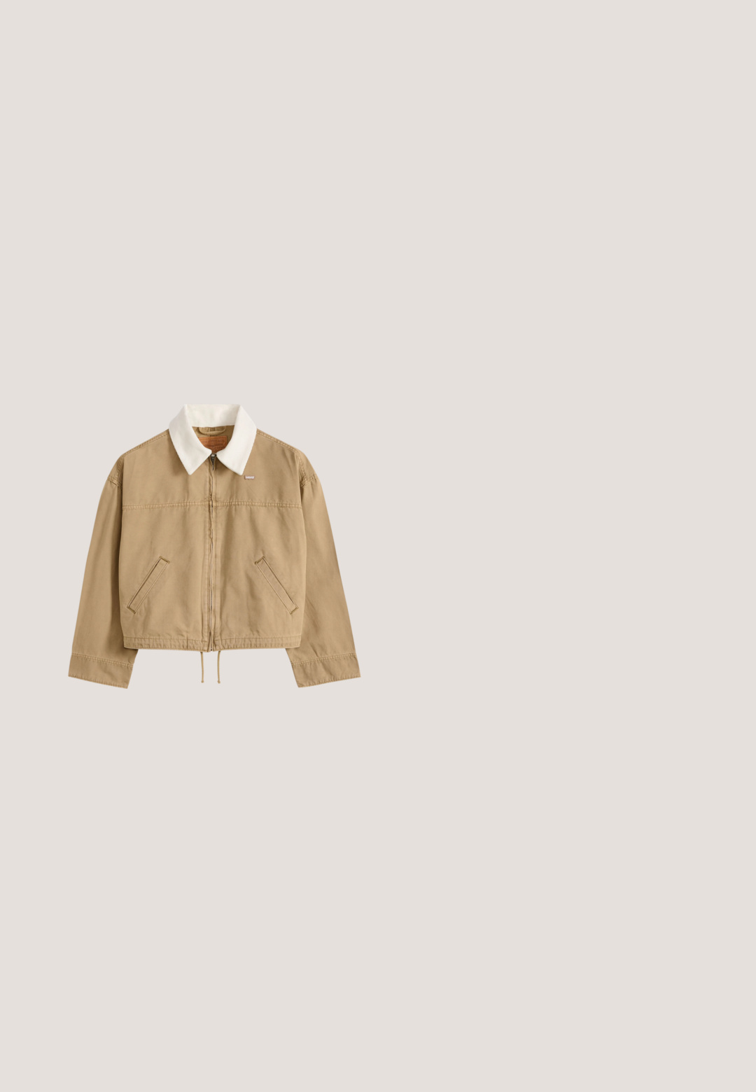 Beige jas met rits, witte ribfluwelen kraag, schuine voorzakken, lange mouwen en aantrekkoord onderaan, plat neergelegd op een lichte achtergrond.; Bruine corduroy jumpsuit met een kraag, lange mouwen, flare benen, borstzakken en metalen knoopaccenten. Vlotte textuur en getailleerd ontwerp.; Gebreide trui in lichtbeige met een geometrisch bruin en wit patroon. Heeft een ronde hals en ribgebreide manchetten en zoom. Korte snit.; ONLY SHOES ONLSIBU-1 RETRO - Sneakers laag - brown/black;  Schildpadbril met cat-eye ontwerp, bruine gradient lenzen en zilveren hardwareaccenten op het montuur. Glanzend kunststof materiaal.; Donkerbruine suède crossbodytas met een verstelbare riem en een ritsvak aan de voorkant, staand tegen een effen lichte achtergrond.