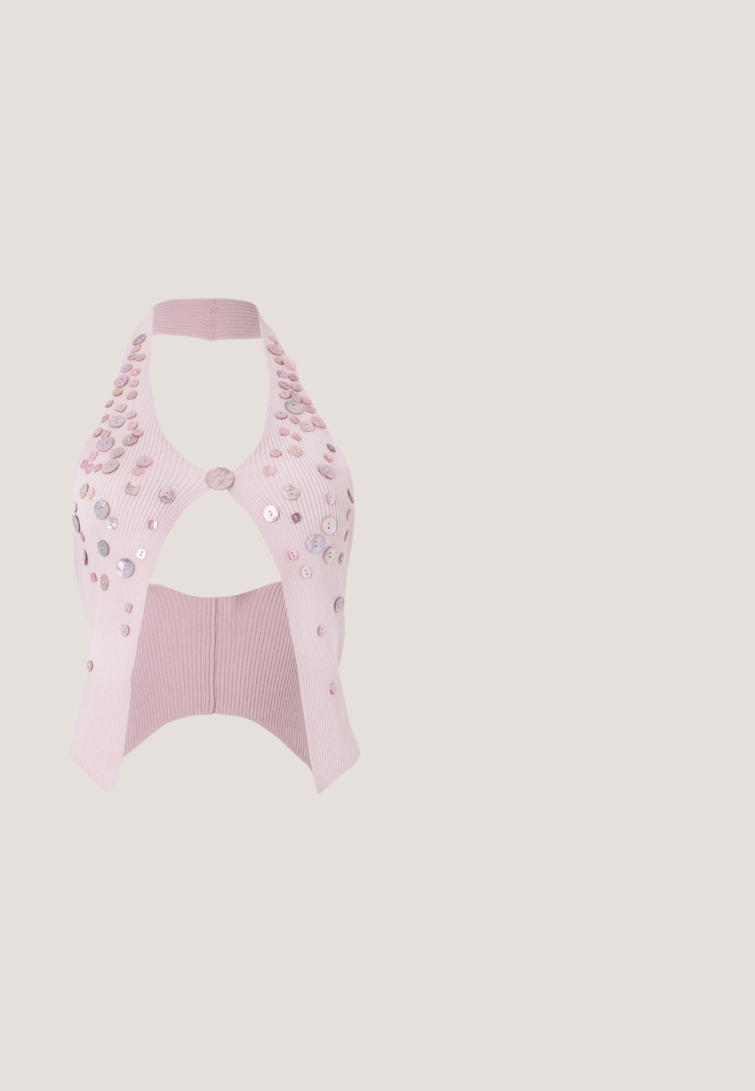 Pink ribbed crop top featuring a halter neck, cut-out design, adorned with various sizes of shiny buttons on one side.; Black wide-leg denim jeans with front button closure and visible stitching, laid flat on a light background.; White chunky sneaker with thick textured sole, silver star and butterfly decorations on white laces, and silver studs on heel tab.; Oval glasses with a metallic silver frame, clear lenses, and textured beaded temple accents. Lightweight design with curved arms.; Silver metallic crescent-shaped shoulder bag with black adjustable strap and zipper closure on plain light background.; Silver chain necklace with round links and an adjustable extension chain ending in a small circular charm on a white background.