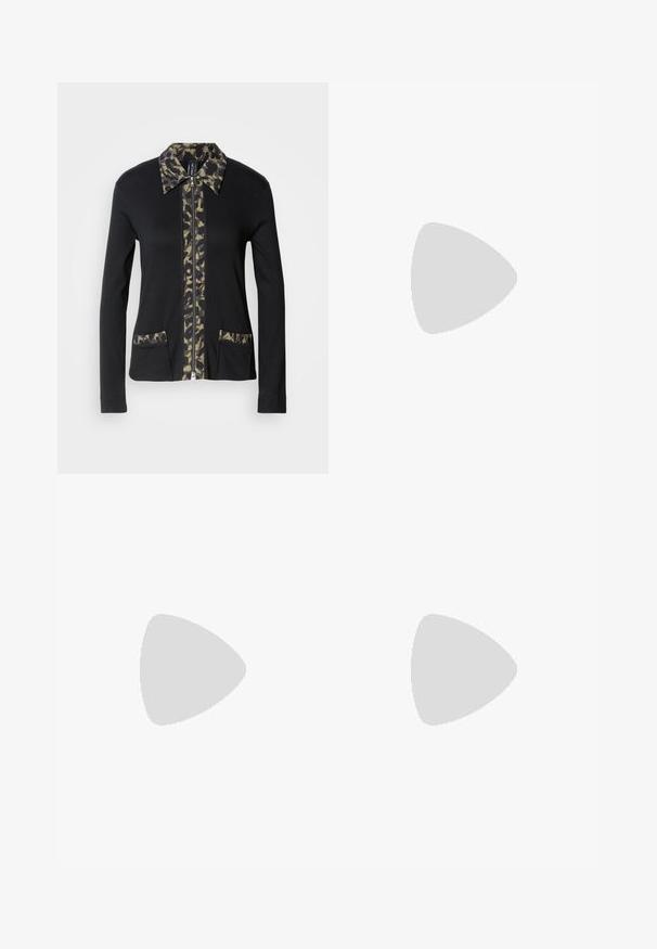 Veste zippée noire avec un col et un panneau avant à motif camouflage, dotée de deux poches avant avec des détails assortis. Manches longues.; Débardeur blanc côtelé avec un col rond et sans manches. Tissu extensible et design ajusté. Étiquette au dos indiquant "GESTUZ."; Jean en denim bleu clair avec une coupe droite, dotés d'une fermeture à bouton et à glissière, de cinq poches et d'une taille mi-haute.; Ballerines en cuir noir avec un bout arrondi, un petit nœud décoratif et un petit talon en bois, portées avec une jupe en denim.