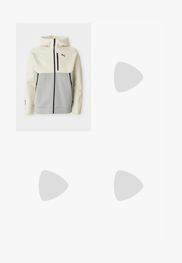 Chaqueta con capucha de Puma que presenta una parte superior en crema y una sección inferior en gris, con cierre frontal, dos bolsillos y detalles del logo en negro.; Camiseta marrón de manga corta con cuello redondo y pequeño logotipo blanco de Puma en el lado izquierdo del pecho sobre un fondo blanco.; Pantalones de chándal negros con cintura elástica y cordón, con bolsillos laterales y un sutil logo en la pierna izquierda. Tela suave, forma acampanada.; Zapatillas deportivas de ante marrón con detalles blancos, diseño de perfil bajo, puntera redondeada y suela de goma negra. Cuenta con cordones y detalles de logotipo.