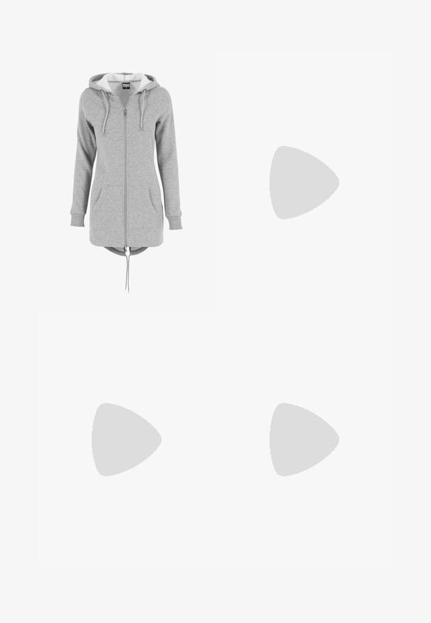 Grå zip-up hoodie med en stor hætte, snører, forlommer og en buet kant. Lavet af blød, tekstureret stof med en kontrasterende inderside.; Sort bomulds T-shirt med rund halsudskæring, korte ærmer og en afslappet pasform. Har en glat tekstur og minimalistisk design.; Sorte leggings i glat stof, med høj talje, tætsiddende design og uden synlige sømme, velegnet til afslappet eller aktivt brug.; Hvide sportsko med lyserøde accenter, lavet af ruskind og læder, rund tå og gummisål, vist med lyse sokker på en gul baggrund.