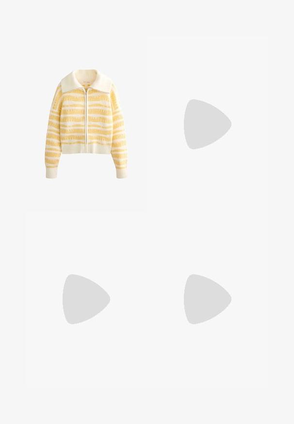 Veste zippée en maille avec une base blanc crème et de larges rayures horizontales jaunes, texture douce et grand col.; T-shirt blanc à manches courtes en coton doux, avec un col rond et une coupe ajustée. Pas de motifs ni d'ornements visibles.; Pantalon blanc taille haute à jambes larges, avec plis à l'avant, passants pour ceinture et fermeture par bouton noir à la taille.; Baskets Adidas Spezial blanches avec des rayures noires et une semelle en gomme flottant au-dessus de marches en pierre grises à l'extérieur.