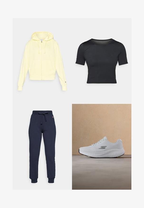 Kollane lukuga dressipluus pehmest kangast, millel on kapuuts, kängurutasku ning logo rinnal ja varrukal. Soonilised varrukaotsad ja ääred.; Must värviline lühikeste varrukatega crop top, mis on valmistatud siledast ja venivast kangast, ümmarguse kaelusega ja õlgadel peente õmblusdetailidega.; Tumesinised puuvillasegused dressipükse, millel on nööriga vöökoht, ribakudumine, ning väike logo puusal.; Valge spordijalats tekstuurse taldaga ja võrgustatud pealiskihiga, millel on hõbedane "S" logo, hõljumas beeži vaiba ja diivani taustal.