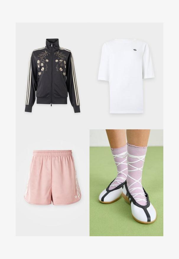 Zwarte trainingsjas met rits en hoge kraag, crèmekleurige bloemenborduursel aan de voorkant en drie crèmekleurige strepen langs de mouwen.; Wit Adidas T-shirt met korte mouwen en een klein zwart trefoil-logo op de linkerborst.; Roze sport shorts met een elastische tailleband, witte zijstreepdetails en een klein logo aan de onderkant van de linkervoorzijde. Glad textuur van de stof.; Benen met geribbelde lavendelkleurige sokken met witte kruisbanden, gecombineerd met witte ballerina's met zwarte bies op een groene vloer.