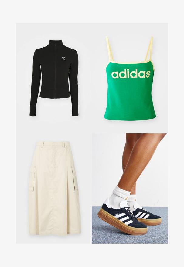 Schwarze Jacke mit Reißverschluss und langen Ärmeln, aus strukturiertem Material, mit einem kleinen blauen Adidas-Logo auf der linken Brust.; Grünes Tanktop mit gelben Akzenten, aus dehnbarem Material. Lieferumfang: großes gelbes "adidas"-Logo auf der Vorderseite und dünne Träger.; Beige, knielanger Rock aus Baumwolle. Verfügt über zwei seitliche Cargo-Taschen und eine vordere Falte, mit einem Bund und einem versteckten Reißverschluss.; Beine mit weißen Socken und schwarzen Adidas Gazelle Sneakers mit weißen Streifen und dicken braunen Sohlen auf einem grauen Teppichboden.
