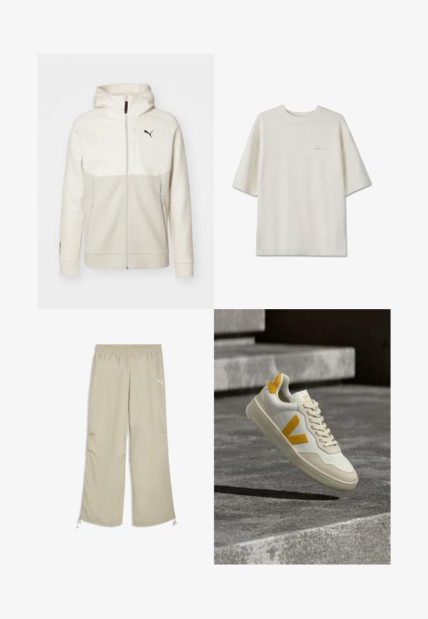 Vaalean beige vetoketjullinen huppari, jossa on huppu, suunniteltu kermaisten paneelien kanssa, korkea kaulus, kaksi vetoketjullista taskua ja musta logo rinnassa.; Valkoinen lyhythihainen neulepusero, jossa on ribbineulosta ja pyöreä pääntie, pieni hillitty logo vasemmassa rinnassa.; Vaaleanbeiget, joustavat Puma-verryttelyhousut, joissa sivutaskut ja säädettävät nyörit nilkkakohdassa.; Valkoinen ja beige lenkkarit, joissa on keltaisia yksityiskohtia ja "V"-logo, roikkuvat teksturoidun harmaan kivipinnan yläpuolella, taustalla betoniset portaat.