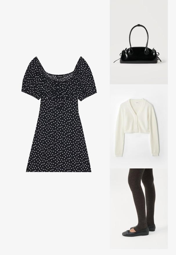 Gilet court en tissu blanc doux avec un décolleté en V, des manches longues et un détail texturé, doté d'une fermeture à boutons à l'avant.; Robe noire courte avec des pois blancs irréguliers, manches ballons, décolleté carré et détail de nœud à l'avant.; Jambes portant des leggings côtelés foncés associés à des ballerines noires avec de petits détails en nœud sur fond blanc.; Petit sac à main noir brillant avec deux longues anses et des détails à cordon sur les côtés sur un fond clair uni.