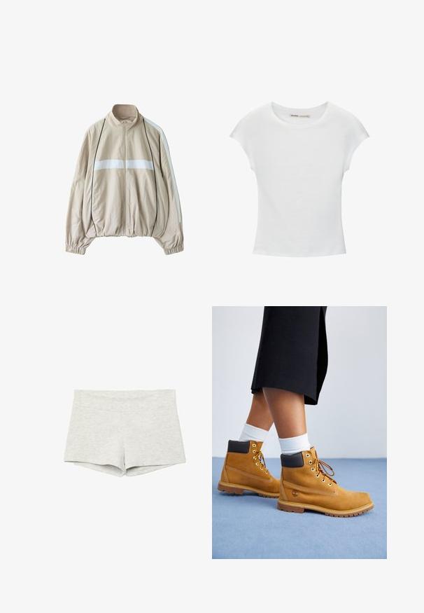 Veste beige zippée avec bande horizontale blanche sur la poitrine, bandes blanches aux manches, passepoil noir, poignets élastiques et ourlet froncé.; T-shirt en coton blanc avec manches courtes retroussées, encolure ronde et ourlet droit. Texture lisse sans motifs ni accents visibles.; Shorts gris clair taille haute ajustés avec une texture lisse, sans motifs ni logos visibles.; Bottines en suede beige avec des accents en cuir marron, des œillets dorés et une semelle texturée. Chaussettes blanches visibles au-dessus des bottines.