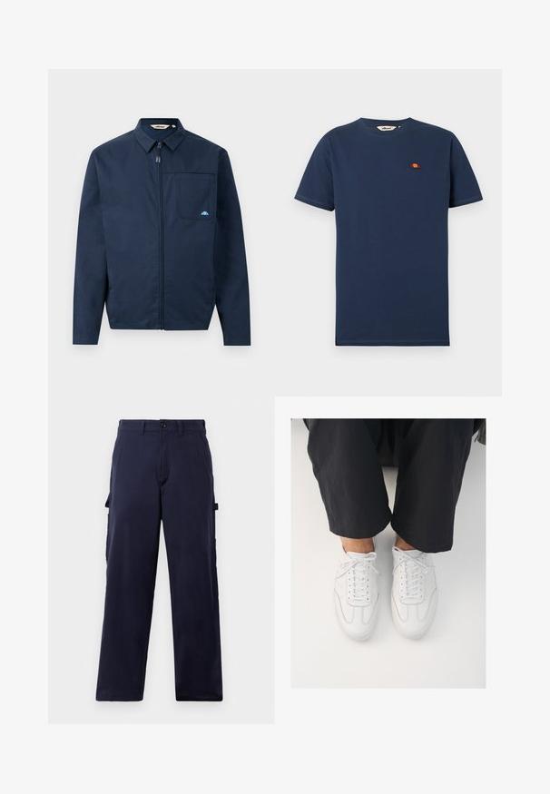 Chaqueta azul marino de tejido suave, con cremallera frontal, cuello puntiagudo y un bolsillo en el pecho con un pequeño acento de logo.; Camiseta de manga corta y cuello redondo de color azul marino con un pequeño logo semicircular en rojo y naranja en el pecho izquierdo.; Pantalones rectos de color azul marino con pasadores para cinturón, cierre delantero con botón y bolsillos laterales para herramientas, exhibidos sobre un fondo blanco.; Zapatillas de cuero blanco con una textura lisa, punta redonda y sistema de cierre clásico, posicionadas sobre pantalones oscuros de corte holgado.