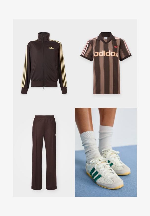 Zwarte joggingjas met rits en hoge kraag, lichtgele strepen op de mouwen en Adidas trefoil-logo op de linkerborst.; Bruine gestreepte Adidas polo met V-hals, bordeauxrode kraag en rood logo. Heeft witte en rode schouderstrepen, korte mouwen.; Bruine sportieve broek met een elastische tailleband, twee zijzakken en een klein logo aan de linkerzijde, gemaakt van een zachte stof.; Voeten met witte sneakers met groene strepen en witte geribbelde sokken die op een lichtblauw tapijt staan.