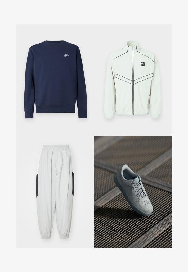 Hvid letvægtsjakke med høj krave, sort lynlås og broderet logo. Har sorte kantbånd og elastiske manchetter for et tætsiddende look.; Marineblå sweatshirt lavet af blødt stof, med rund halsudskæring og lange ærmer samt en lille hvid Nike-logo på brystet.; Lys grå træningsbukser lavet af letvægtsstof, med elastisk talje og manchetter, samt kontrasterende sorte og hvide sidelapper.; Grå lædersneaker med perforeret tå, flade snørebånd, polstret krave og struktureret gummisål. Har en subtil brandingdetalje.