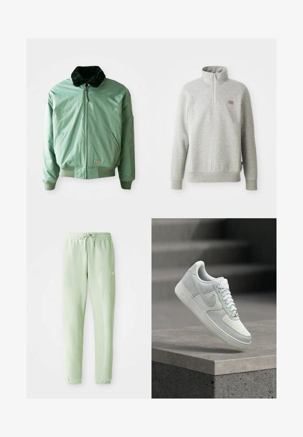 Groene bomberjack met een zwart nepmoffelkragen, ritssluiting, geribde manchetten en tailleband, en zijzakken. Glad, glanzend materiaal.; Grijze pullover sweatshirt met een hoge kraag, kwart rits aan de voorkant en geribde manchetten. Kenmerkt zich door een klein logopatch op de linkerborst.; Lichtgroene sweatpants van zachte katoen, met een elastische tailleband met trekkoord en taps toelopende benen, afgewerkt met gathered boorden.; Witte Nike Air Force 1 sneaker met mesh en leren delen, veters gestrikt, zwevend boven een betonnen richel tegen een wazige achtergrond van traptreden.