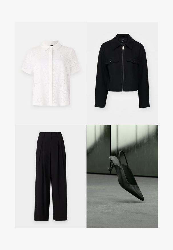 Kurze schwarze Jacke aus weichem Stoff mit einem Reißverschluss vorne, spitzem Kragen und zwei Brusttaschen mit silbernen Druckknöpfen.; Weißes Kurzarmhemd aus Spitze mit Kragen und durchgängigem Knopfverschluss, das mit floralen Mustern im gesamten Material versehen ist.; Schwarze weite Stoffhosen aus glattem Material, mit hohem Bund, Falten vorne und fließender Silhouette.; Schwarzer Slingback-Highheel aus Leder mit spitzer Schuhspitze, schwebt über grauem Teppichboden, unscharfer grünlicher Wandhintergrund.