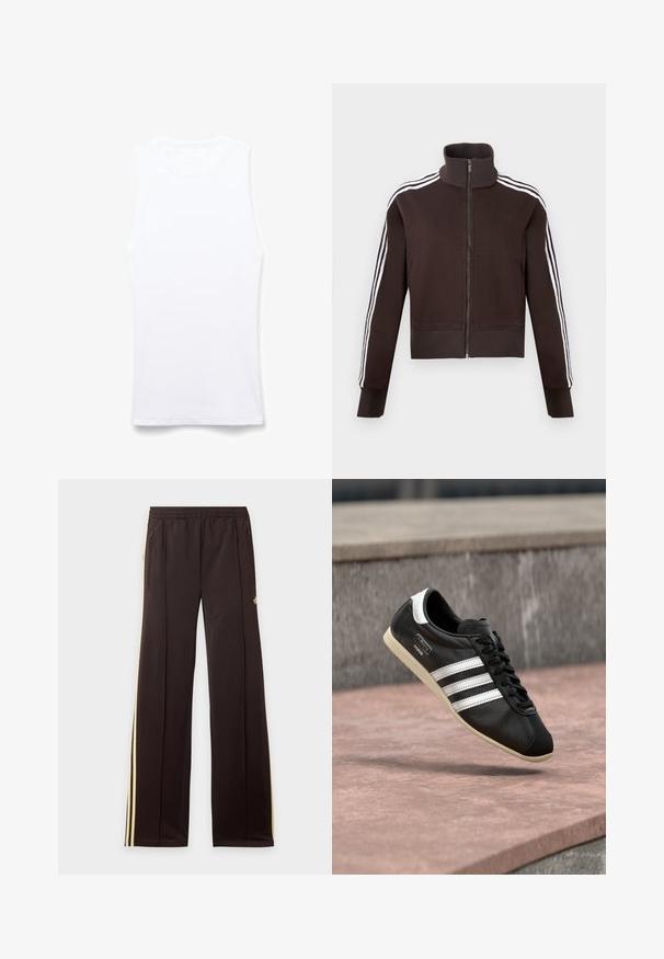 Veste marron à fermeture éclair avec col montant, dotée de bandes blanches sur les côtés et de poignets et ourlet côtelés. Tissu doux avec une coupe ajustée.; Débardeur blanc sans manches en tissu côtelé. Dispose d'un col rond et de coutures plates. Design simple, sans motifs ni embellissements.; Pantalon de survêtement noir avec des bandes latérales jaunes, taille élastique, poches latérales zippées et un petit logo sur la partie supérieure de la cuisse.; Baskets en cuir noir avec des rayures blanches et une semelle blanche, lacées, flottant au-dessus d'une surface en béton rosée avec un mur en pierre grise en arrière-plan.