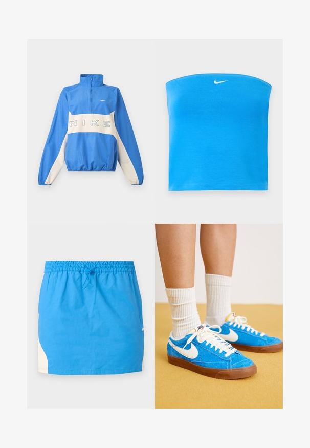 Modro-biela mikina Nike s polovičným zipsom, elastickými manžetami a lemom, s textom loga Nike cez hruď a malým symbolom Swoosh na ľavej strane.; Svetlomodrý bezramienkový tube top značky Nike s bielym logom Swoosh umiestneným v strede blízko horného okraja.; Modrá športová sukňa s elastickým pásom a sťahovacou šnúrkou, s bielymi bočnými panelmi a malým bielym logom Nike na pravej strane.; Modré semišové tenisky Nike s bielymi akcentmi, plochými šnúrkami a hnedými gumovými podrážkami, doplnené o rebrové biele ponožky.