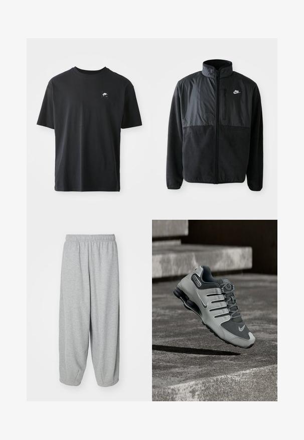 Zwarte Nike fleece jacket met volledige rits, hoge kraag, ritszak op de borst en contrasterend stoffenpaneel aan de bovenkant van de voorkant.; Zwarte katoenen T-shirt met korte mouwen, ronde hals, met een klein rechthoekig logo met "NIKE AIR" in het wit op de linkerborst.; Lichtgrijze, loszittende sweatpants gemaakt van zachte stof. Elastische tailleband en boorden bij de enkels. Eenvoudig en onversierd ontwerp.; Grijze en zwarte Nike Shox sportschoen zwevend boven een getextureerd betonnen oppervlak met schaduwen eronder.