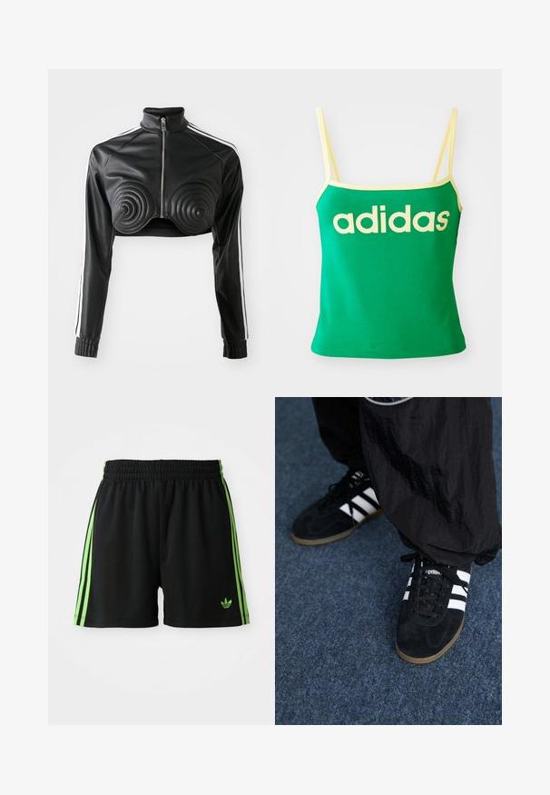 Schwarze, kürzere Jacke aus Kunstleder, mit spiralförmigen gepolsterten Akzenten auf der Brust, durchgehendem Reißverschluss und weißen Seitenstreifen an den Ärmeln.; Grünes Tanktop mit gelben Akzenten, aus dehnbarem Material. Lieferumfang: großes gelbes "adidas"-Logo auf der Vorderseite und dünne Träger.; Schwarze Sportshorts mit einem Kordelzugbund, die auf jeder Seite drei vertikale grüne Streifen und das grüne Adidas-Logo aufweisen.; Schwarze Wildleder-Sportschuhe mit drei weißen Streifen und schwarzen Schnürsenkeln. Eine strukturierte schwarze Hose ist teilweise neben den Schuhen sichtbar.
