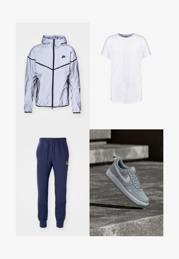 Nike Sportswear Leichte Jacke - reflect silver; Weißes Baumwoll-T-Shirt mit kurzen Ärmeln, Rundhalsausschnitt und lockerer Passform. Glatte Textur und keine sichtbaren Muster oder Designs.; Navyblaue Sweatpants mit elastischem Bund, Seitentaschen und schwarzem/gelbem Logo-Patch, mit strukturierten Panel-Akzenten in der Nähe der Knöchel.; Grauer Nike Air Force 1 Sneaker mit weißem Swoosh-Logo, schwebt über einer strukturierten Betonoberfläche mit Treppen im Hintergrund.