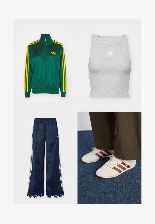 Grüne Satin-Trainingsjacke, mit Reißverschluss vorne, hohem Kragen, gelbem Drei-Streifen-Design an den Ärmeln und kleinem gelben Logo auf der Brust.; Graues, ärmelloses Crop-Top aus weichem Stoff, mit Rundhalsausschnitt und kleinem weißen Adidas-Logo auf der Brust.; Marineblaue Trainingshose mit weitem Bein, weißen Seitenstreifen, elastischem Bund, adidas-Logo an der Hüfte und Spitzenbesatz am Saum.; Weiße Sneaker mit braunen Streifen, getragen mit braunen Hosen auf einem blauen Teppichboden.