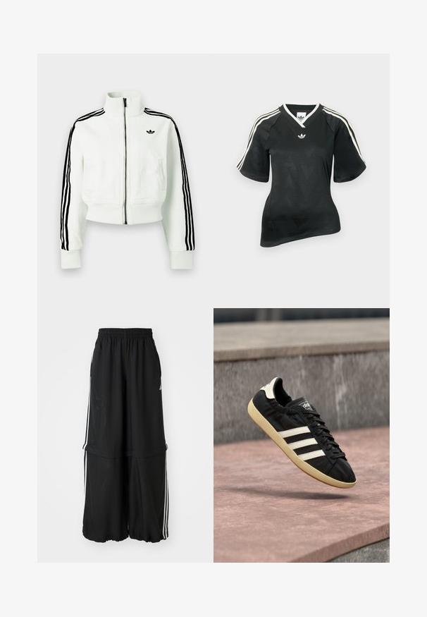 Weiße kurze Jacke mit hohem Kragen, Reißverschluss vorne, schwarzen Streifenakzenten an den Ärmeln und einem kleinen schwarzen Logo auf der Brust.; Schwarzes Sportshirt mit V-Ausschnitt, kurzen Ärmeln und strukturiertem Chevron-Muster. Mit weißen drei-Streifen-Akzenten auf den Schultern und Logo.; Schwarze Trainingshose mit elastischem Bund, seitlichen Streifen und lockerer Passform mit gerafftem Saum für eine fließende Silhouette.; Schwarzer Adidas-Sneaker mit weißen Streifen und beiger Sohle, in der Luft über einer steinernen Oberfläche und mit Steinwand im Hintergrund aufgenommen.
