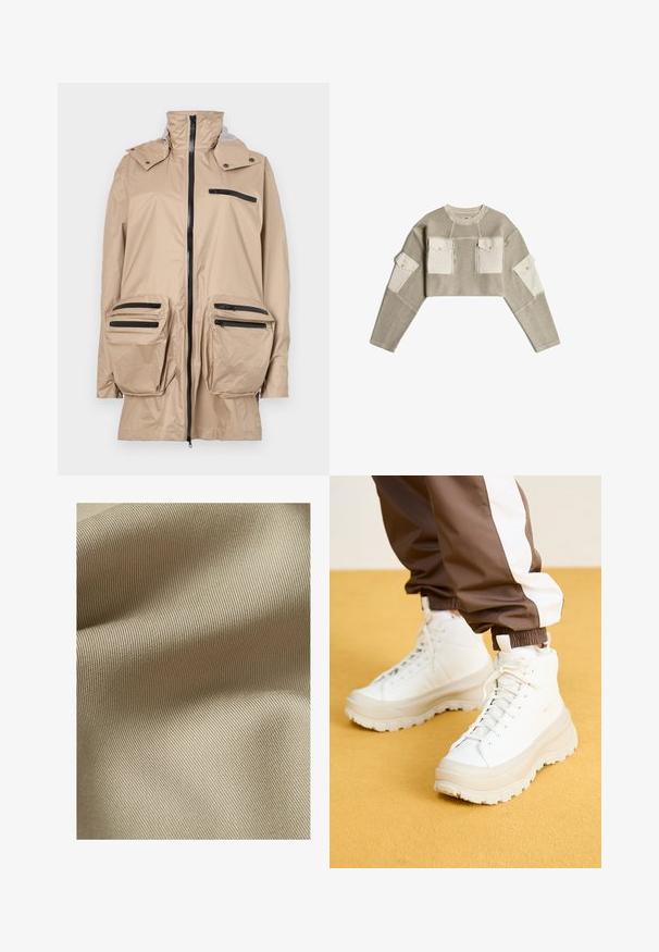 Beige waterdichte jas met hoge kraag, ritssluiting aan de voorkant en meerdere zwarte ritszakken op de borst en heupen. Glad textuur.; Korte beige gebreide trui met crème stoffen patches op de borstzakken en bovenste mouwen, met ritsen en knopen.; Beige gestructureerde stof met een fijn, ribbelpatroon. Het materiaal lijkt glad met een subtiele glans en valt zacht in plooien.; Witte hoge sneakers met een chunky, gestructureerde zool, voorzien van een gladde bovenkant, ronde neus en tonale veters, tegen een gele achtergrond.