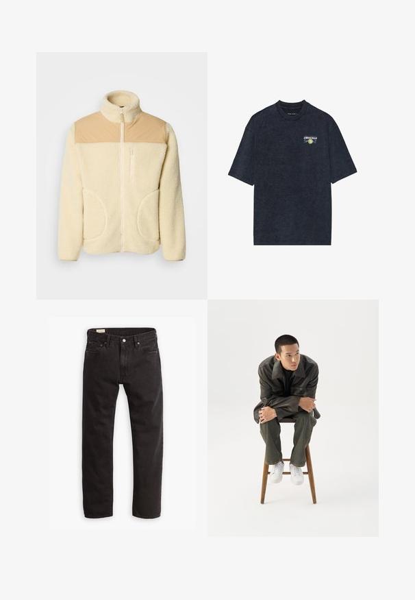 Fleece-Jacke in Creme mit einem oberen Abschnitt aus braunem Nylon, hohem Kragen, durchgehendem Reißverschluss und zwei seitlichen Taschen mit abgerundeten Kanten.; Dunkelblaue kurzärmelige T-Shirt aus weicher Baumwolle mit einem kleinen Limoncello-Graphic auf der Brust und floralen Akzenten. Lockere Passform, Rundhalsausschnitt.; Schwarze Denim-Jeans mit geradem Bein, ausgestattet mit einem klassischen Fünf-Taschen-Design, subtilen Nähten und einem Metallknopfverschluss.; Junger Mann in dunkler Lederjacke und Jeans sitzt auf einem Holzstuhl, lehnt sich mit verschränkten Armen nach vorne und schaut seitlich vor weißem Hintergrund.