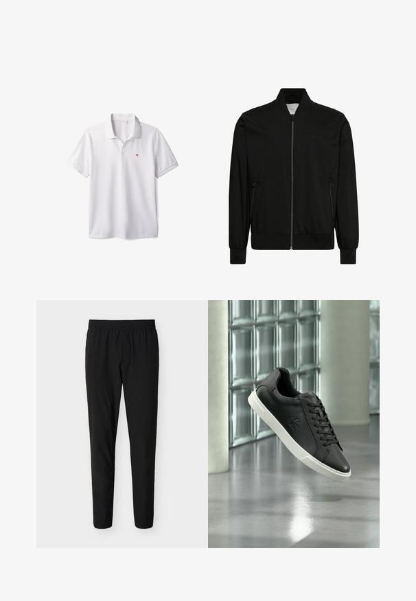 Zwarte bomberjas met rits aan de voorkant, geribde kraag, boorden en zoom, en ritszakken aan de zijkanten.; Witte poloshirt met korte mouwen, kraag en klein rood "cK" logo op de linkerborst.; Zwarte slim-fit broek met elastische tailleband, rechte pijpen en zonder zichtbare zakken of versieringen.; Zwarte lage sneaker met witte zool, veters en een reliëflogo, weergegeven tegen een achtergrond van glazen blokken en betonnen kolommen.