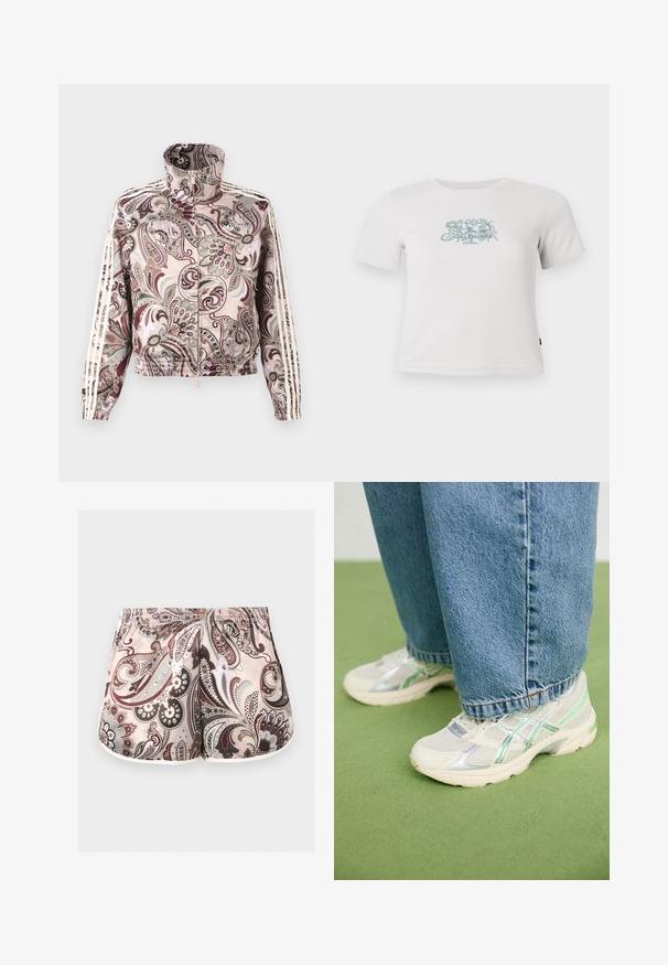 Chaqueta rosa claro con cremallera y cuello alto, con un elaborado estampado de cachemira en tonos marrones y grises, y tres franjas blancas a lo largo de las mangas.; Camiseta blanca de manga corta con coste ribeteado y un pequeño gráfico floral verde centrado en el pecho.; Pantalones cortos femeninos con cintura elástica, con intrincados patrones de paisley en tonos beige, marrón, gris y blanco.; Zapatillas de malla blancas y plateadas con detalles en verde, combinadas con unos vaqueros azules holgados, de pie sobre un suelo de moqueta verde.