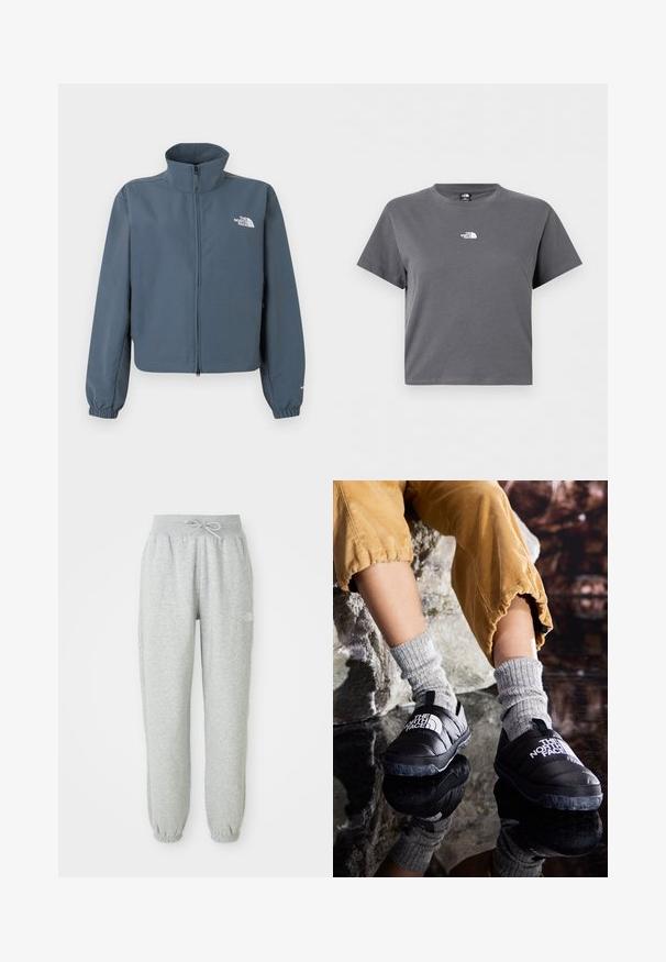 Blaue Jacke mit durchgehendem Reißverschluss, hohem Kragen, elastischen Bündchen und weißem The North Face-Logo auf der linken Brust.; Kurzärmeliges, graues, bauchfreies T-Shirt mit Rundhalsausschnitt und kleinem weißem The North Face-Logo in der Mitte der Brust.; Graue Sweatpants mit einem elastischen Bund und Kordelzug. Der Stoff ist weich, mit elastischen Bündchen an den Knöcheln und einem Logo-Detail.; Schwarze isolierte Schlupfschuhe mit strukturierten Sohlen und weißem Logo, getragen mit grauen Strümpfen aus Strick, kombiniert mit ribbeligen, senffarbenen Hosen.