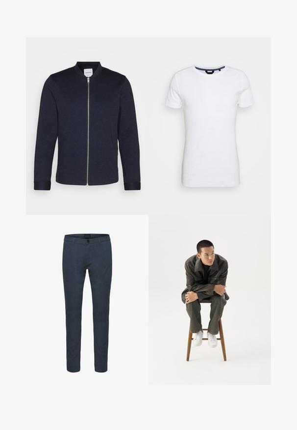 Mørkeblå bomberjakke med frontlynlås, rund halsudskæring og manchetter. Lavet af et glat stof med et minimalistisk design.; Lindbergh T-shirts basic - white; Mørkeblå skræddersyede bukser lavet af stof, med knaplukning, for- og baglommer samt en slim fit design. Glat tekstur med subtil glans.; Ung mand i mørk læderjakke og jeans sidder på en træskammel, læner sig fremad med armene krydset og kigger til siden mod hvid baggrund.