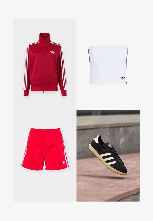 Rode trainingsjas met witte drie-streep details op de mouwen, volledige rits aan de voorkant, hoge kraag en wit Adidas trefoil-logo op de borst.; Witte bandeau-top gemaakt van rekbaar materiaal. Bevat zwarte zijstrepen en een klein zwart logo aan de onderrand. Glad van textuur.; Rode sportieve shorts met een elastische tailleband, voorzien van witte zijstreepjes en een geborduurd logo aan de onderste linkerkant. Glad textuur.; Zwarte Adidas sneaker met witte strepen en beige zool, vastgelegd in de lucht boven een stenen oppervlak en een stenen muur op de achtergrond.