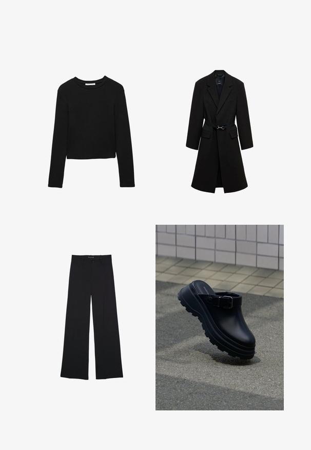 Sort skrædderjakke med bæltestrop i taljen, spids lapels og to forlommer. Glat stof med en struktureret silhuet.; Sort langærmet cropped T-shirt lavet af blødt bomuld med klassisk rund halsudskæring og afslappet pasform. Ingen synlige mønstre eller accenter.; Sorte bukser med vide ben med knap- og lynlåslukning, bæltestropper og en glat, skræddersyet finish.; Sort slip-on træsko med tyk rillede sål og justerbar rem, placeret over asfalt med flisebelagt væg i baggrunden.
