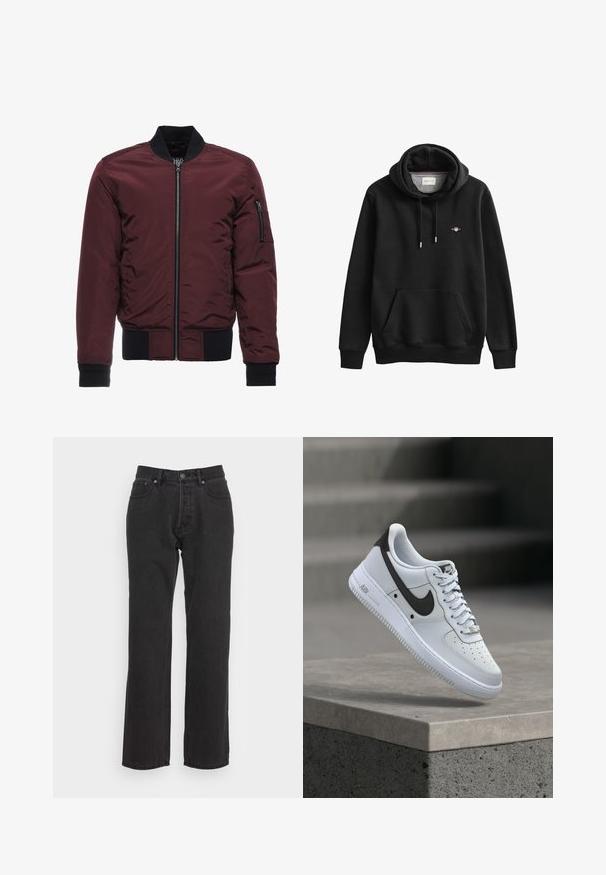 Burgundská bomber bunda so zipsom, rebrovanými manžetami a lemom, a vreckom na zips na rukáve. Hladká, lesklá látka s vypchávkovým vzhľadom.; Čierna mikina s kapucňou s predným vreckom, šnúrkami a malým logom GANT na ľavej strane hrudníka.; Čierne džínsy s rovným strihom, s predným zapínaním na gombík, pútka na opasok a dvoma bočnými vreckami. Textúrovaná tkanina.; Biela teniska Nike Air Force 1 s čiernym logom Swoosh, vznášajúca sa nad betónovým okrajom s rozmazanými schodmi na pozadí.