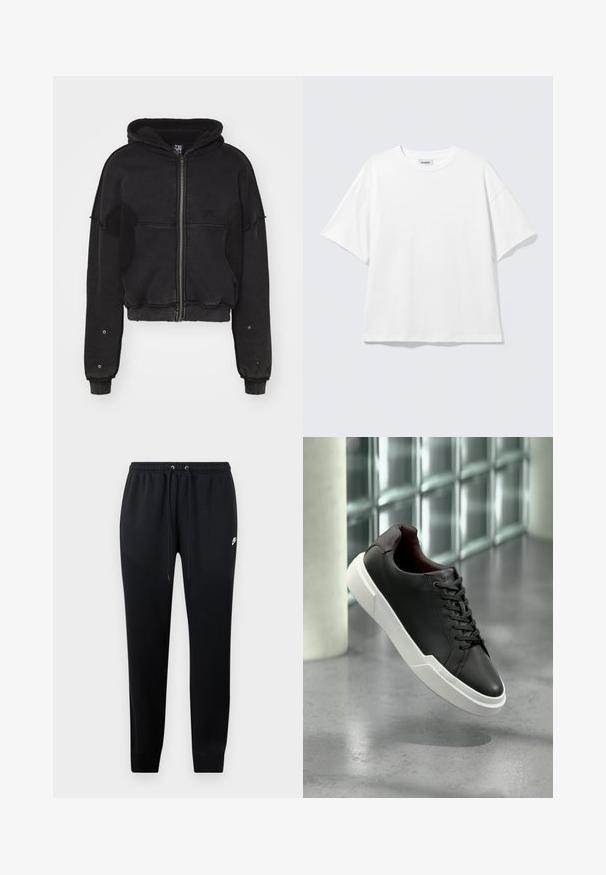 Atelier de roupa SNUG JACKET UNISEX - Flísová bunda - black; Biele oversize tričko s krátkym rukávom a okrúhlym výstrihom s padnutými ramenami, položené na svetlošedom pozadí.; Čierne teplákové nohavice z mäkkej tkaniny, s elastickým pásom na šnúrky, s manžetami na členkoch a malým logom na boku.; Čierna kožená teniska s hrubou bielou podrážkou a čiernymi šnúrkami, ktorá pláva nad sivou betónovou podlahou pri stene zo sklenných blokov.