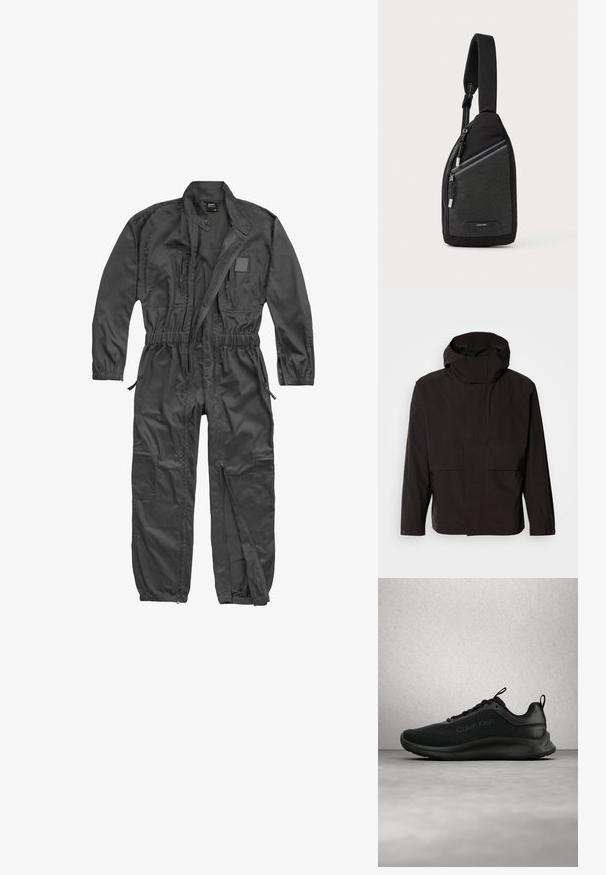 Zwarte capuchonjack met een minimalistisch ontwerp, ritssluiting en twee voorzakken. Gemaakt van glad, lichtgewicht stof.; Zwarte overall met lange mouwen, ritssluiting aan de voorkant, elastische taille en manchetten, meerdere ritszakken en een opstaande kraag met drukknop.; Zwarte Calvin Klein sneaker met veters zwevend boven een grijze gepolijste vloer, met glasblokramen op de achtergrond.; Zwarte schoudertas met een gestructureerd ontwerp met rasterpatroon, verstelbare riem en ritssluiting met zilverkleurige metalen accenten.