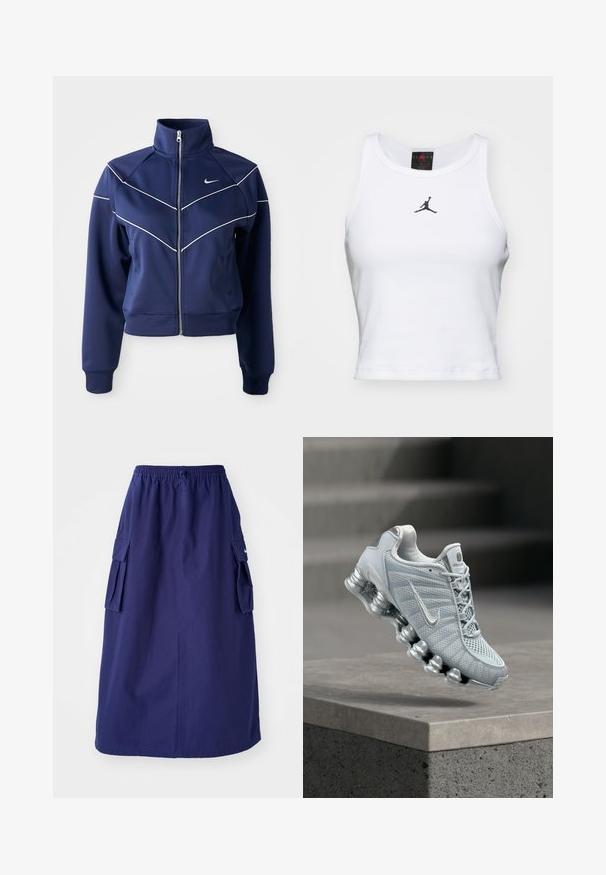 Marine blauwe ritsjack, gemaakt van gladde stof, met een hoge kraag, witte chevron-stiksels en zijzakken. Nike-logo op de borst.; Witte crop tanktop van katoen met een ribbeltextuur. Beschikt over een zwart Jordan-logo in het midden en een klassieke ronde hals.; Marineblauwe, middellange rok met een elastische tailleband, voorzien van twee zijcargo pockets en een minimale logo-opdruk. Gladde stoftextuur.; Lichtgrijze Nike hardloopschoen met gedempte veerachtige zool die boven een betonnen richel zweeft, wazige trapachtergrond.
