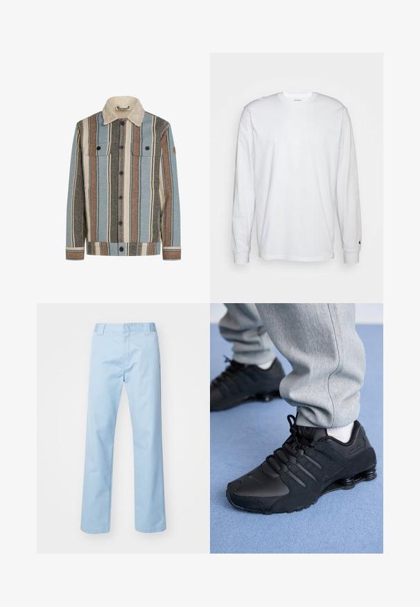 Knapblusejakke med lodrette striber i blå, brun, creme og grå, med en creme sherpa krave og to brystlommer med klap.; Hvid langærmet T-shirt lavet af bomuld. Rund halsudskæring med ribbede manchetter og et lille logo på venstre ærme. Glat tekstur.; Lyseblå lige bukser lavet af en blanding af bomuldsstof. Har en flad frontlinning, sidelommer og ingen synlige mønstre eller udsmykninger.; Person iført sorte Nike Shox sneakers og grå joggingbukser, der står på lyseblåt tæppe.