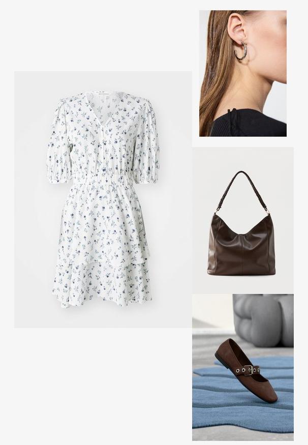 Vestido floral blanco con patrones azules, mangas cortas abullonadas, escote en forma de V, cierre de botones, cintura fruncida y dobladillo con volantes en capas.; Zapato plano de ante marrón con correa de hebilla descansando sobre una alfombra azul texturizada y muebles grises capitoné al fondo.; Bolso de hombro de cuero marrón oscuro con un asa trenzada y detalles visibles de costuras en la parte frontal.; Pendiente de aro de plata con un acabado pulido, que presenta pequeños detalles en dorado y una forma redonda, llevado en el lóbulo.