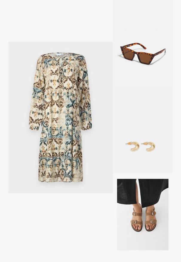 Robe à manches longues imprimée dans des tons naturels, présentant un motif abstrait de bleu, marron et orange. Encolure ronde avec un détail à nouer.; Pieds portant des sandales en daim brun avec des boucles argentées, posés sur une surface blanche, avec un pantalon noir visible au-dessus des chevilles.; Lunettes de soleil teintées de brun avec un motif écaille de tortue, monture angulaire et branches fines. Matériau en plastique léger.; Boucles d'oreilles en forme de croissant en or avec une finition lisse, présentant des accents orange près du clou et un matériel en argent.
