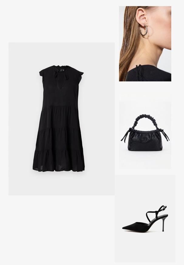 Robe midi noire sans manches à volants avec col froufrou et ouverture devant nouée par un nœud.; Chaussure à talon haut noire à bout pointu avec talon stiletto fin et fines lanières à la cheville avec boucle argentée sur fond blanc.; Sac à main noir avec texture crocodile, bord supérieur froncé, poignée plissée et pompons à cordon de chaque côté sur fond blanc.; Boucle d'oreille en argent avec une finition polie, présentant de petits détails en or et de forme ronde, portée sur le lobe.