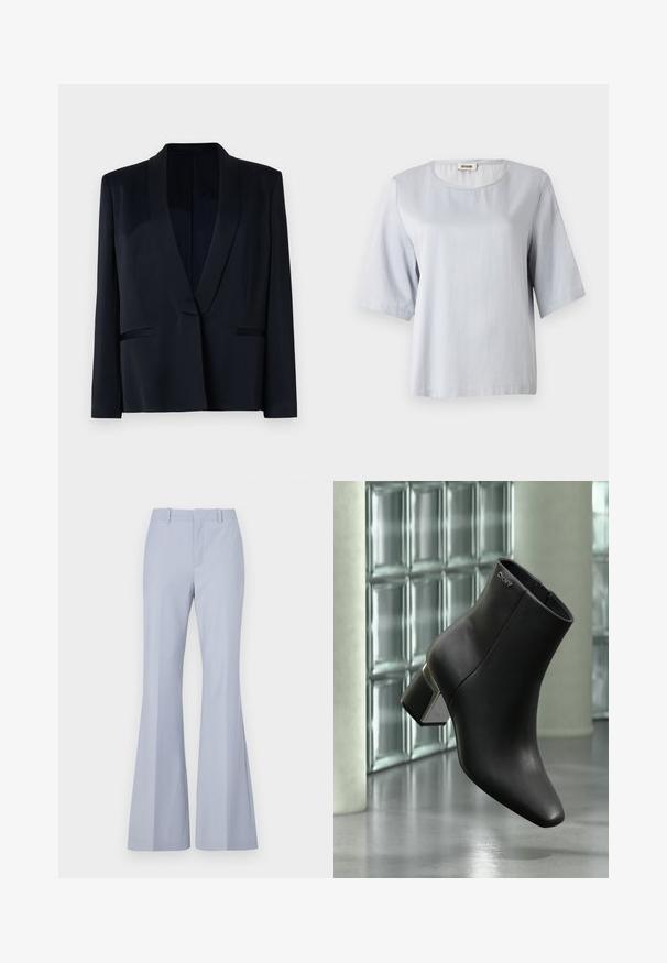 Sort blazer med sjalskrave, enkel knaplukning, to forlommer og en glat stofstruktur. Ingen synlige mønstre eller udsmykninger.; Lys grå kortærmet top med rund halsudskæring, lavet af blødt stof. Enkel design med en løs pasform, featuring rene kanter og ingen udsmykninger.; Lyseblå flared bukser med en glat tekstur, der har en flad front, to sidelommer og et rent liv.; Sort læderankelstøvle med blokhæl, DKNY-logo nær toppen, vist foran en glasblokvæg og poleret betongulv.