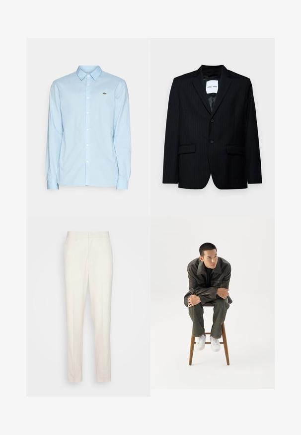 Blazer noir à rayures en tissu lisse, avec un revers cranté, une fermeture à deux boutons et deux poches avant. L'intérieur est doté d'une doublure lisse.; Chemise à manches longues bleu clair en tissu doux, avec un col classique, un devant à boutons et un petit logo vert sur la poitrine.; Pantalons sur mesure de couleur crème avec une coupe droite, fabriqués en tissu texturé. Dotés de passants de ceinture et d'une fermeture à glissière à l'avant.; Jeune homme en veste en cuir foncée et jean, assis sur un tabouret en bois, penché en avant, les bras croisés, regardant sur le côté sur fond blanc.