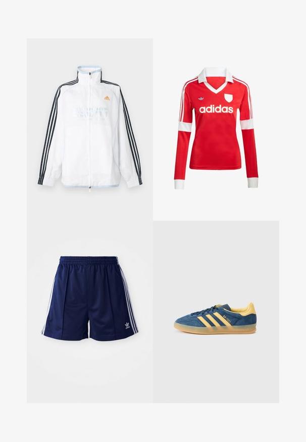 Biela bunda Adidas na zips s vysokým golierom, čiernymi rukávmi s tromi pruhmi a oranžovým logom na hrudi.; Červený futbalový dres s dlhým rukávom a bielym golierom a manžetami. Na ramenách sú tri biele pruhy a výrazne zobrazené logo "adidas".; Námorné športové šortky vyrobené z ľahkého materiálu, s bielymi bočnými pruhmi a vyšívaným logom na dolnej ľavej strane. Elastický pás.; Modrá semišová teniska so žltými akcentmi, s tromi žltými pruhmi, textúrovaným jazykom a priehľadnou gumovou podrážkou. Viditeľné je aj meno značky „Gazelle“.