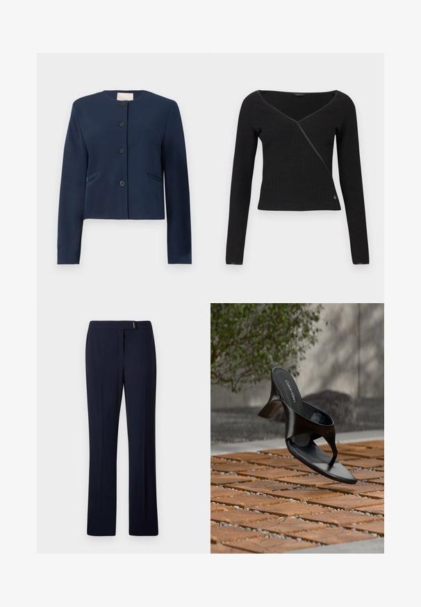 Navyblauwe colberloze jas met lange mouwen, vier zwarte knopen en twee zijzakken, op maat gemaakt.; Zwarte lange mouwen trui met ribbelstructuur, V-hals en gewikkeld ontwerp. Heeft een subtiele glans en een klein logo op de onderste linkerzijde.; Navyblauwe op maat gemaakte broeken van een gladde stof, met een platte voorkant, rechte pijpen en een subtiele zilveren accent bij de taille.; Zwarte Calvin Klein hoge hak teenslipper die zweeft boven een betegeld buitenterrein met groen en een betonnen muur op de achtergrond.