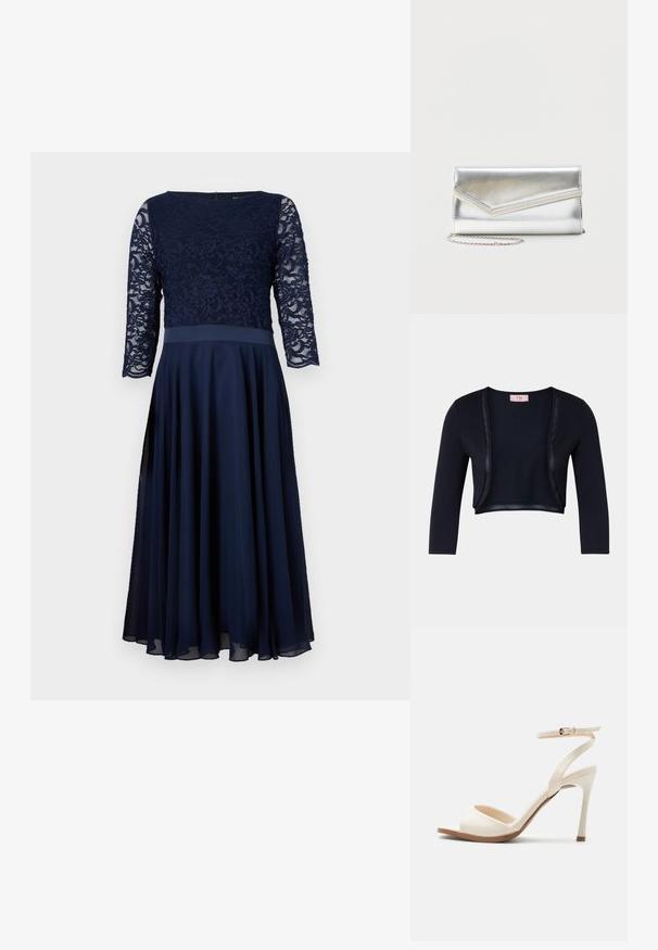 Cardigan court bleu marine avec une texture douce et lisse, doté de longues manches et d'accents en satin le long de l'avant ouvert.; Robe bleu marine avec un corsage en dentelle, des manches trois-quarts et une jupe en chiffon fluide. Texture lisse avec une taille cintrée.; Sandale à talon haut beige avec fine bride de cheville et boucle dorée, bout ouvert et talon aiguille élégant sur fond blanc.; Pochette argentée brillante avec rabat style enveloppe et garniture décorative, petite bandoulière chaîne argentée, sur fond clair uni.