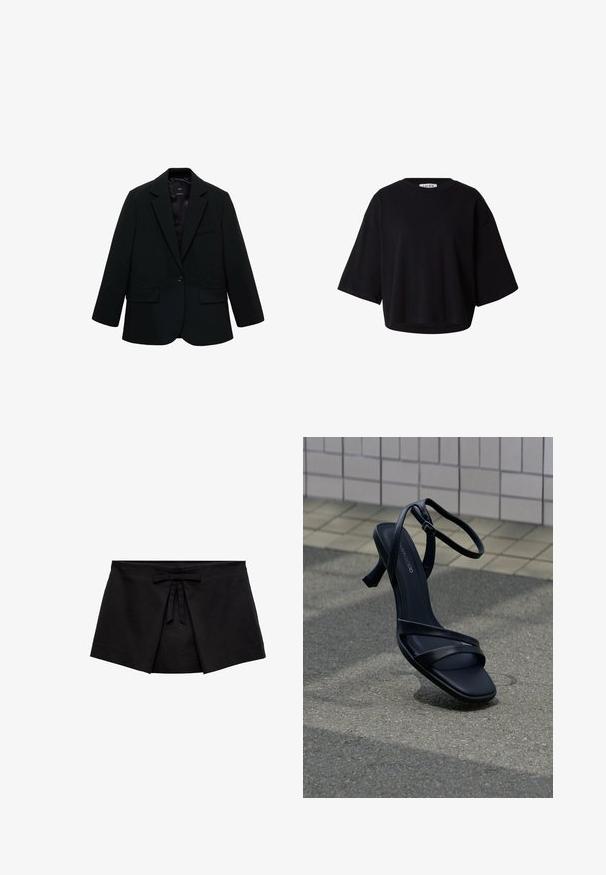 Zwarte blazer van gladde stof. Heeft een enkele knoopsluiting, notch-lapels en twee voorzakken. Simpel, op maat gemaakt ontwerp.; Zwart oversized T-shirt met korte mouwen, ronde hals, losse pasvorm en verlaagde schouders.; Zwarte wikkelstijl minirok met voorplooidetail en een kleine strik bij de tailleband.; Zwarte sandaal met hoge hak en bandjes, met enkelgesp, zwevend boven een gestructureerd grijs trottoir met een betegelde muur op de achtergrond.