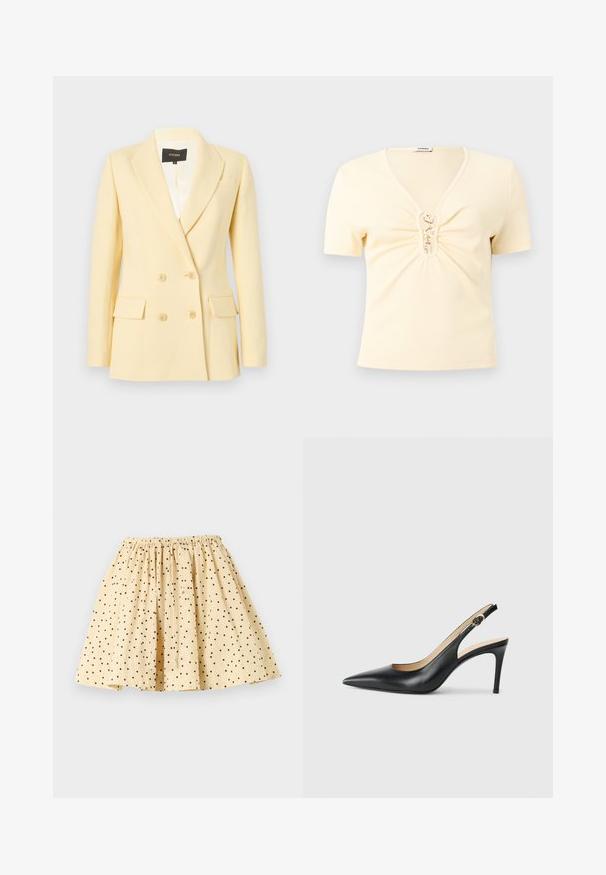 Blazer croisé couleur crème avec revers à encoche, manches longues, deux poches à rabat sur le devant et quatre boutons, présenté sur un fond uni.; Haut crème en maille côtelée à manches courtes avec col en V et fermetures à crochets dorés sur un détail froncé à l'avant.; Jupe beige à pois noirs, taille élastique froncée et design évasé plissé, posée à plat sur un fond clair.; Escarpins en cuir noir avec une pointe fine, une bride ajustable et un talon aiguille élégant, présentant une finition lisse.